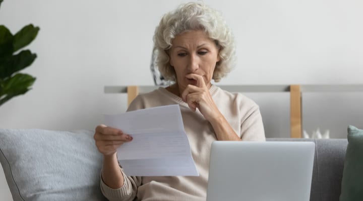 A woman looking at some paperwork.