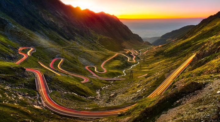 A part of the Transfagarasan road in a valley at sunset