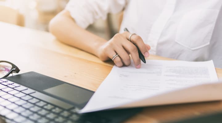 A woman going through some paperwork.