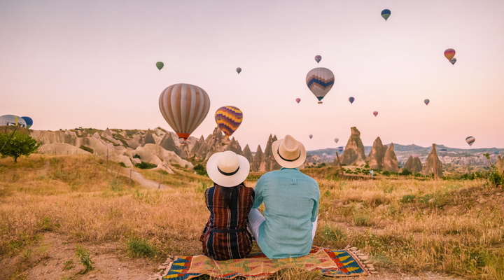 A couple watching hot air balloons in Turkey.