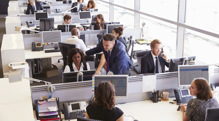 Workers in an open-plan office.