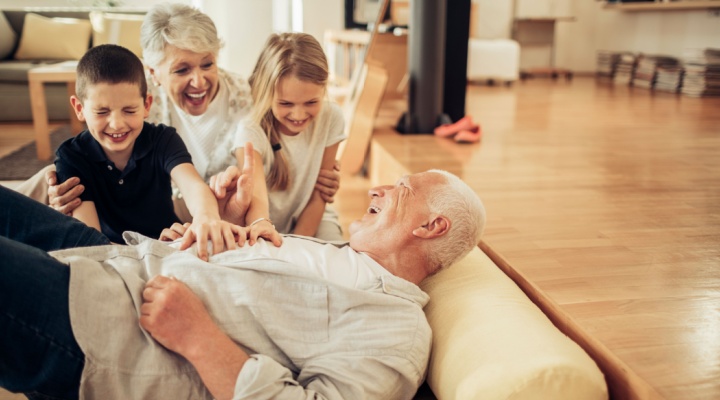 Grandparents playing with their grandchildren.