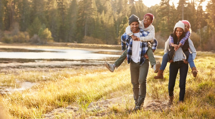 A family hiking in the woods.